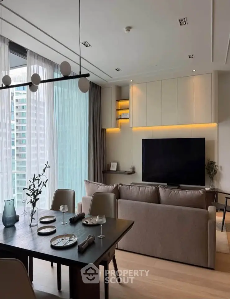 Modern living room with elegant dining area and large windows offering city views.