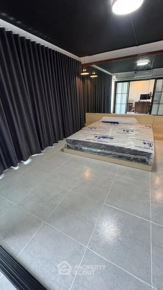 Modern bedroom with sleek design and large windows for natural light