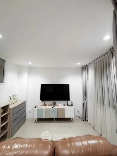 Modern living room with sleek TV setup and stylish decor