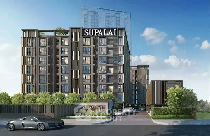 Modern residential building with sleek design and lush greenery in urban setting.