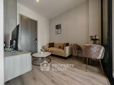 Modern living room with stylish decor and cozy seating area, perfect for relaxation and entertainment.