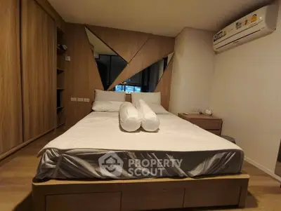 Modern bedroom with stylish wooden accents and air conditioning unit, perfect for comfort and relaxation.