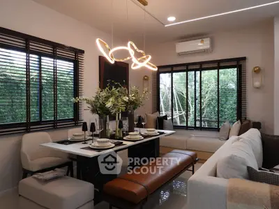 Stylish modern living room with elegant dining area and chic lighting