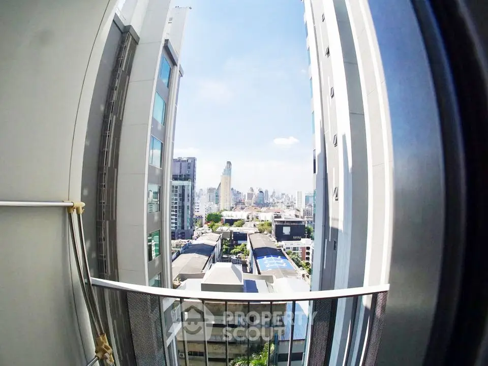 Stunning cityscape view from a high-rise balcony, perfect for urban living enthusiasts.
