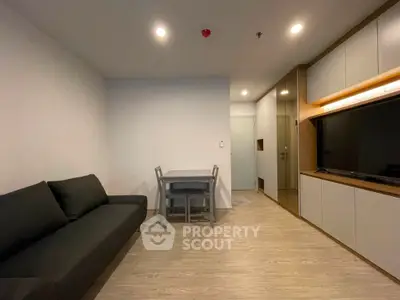 Modern living room with sleek furniture and built-in storage, perfect for urban living.