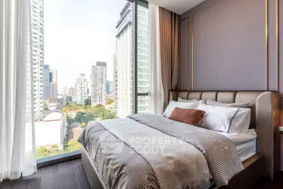 Luxurious bedroom with stunning city view in modern high-rise apartment.
