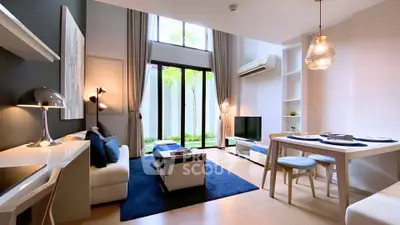 Modern living room with high ceilings, large windows, and stylish decor in a luxury apartment.