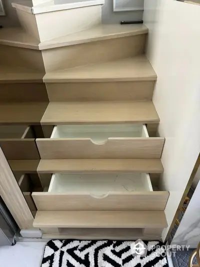 Innovative staircase with built-in storage drawers in modern home interior