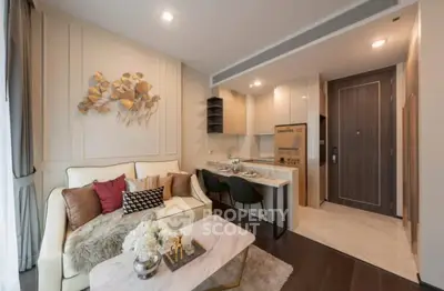 Modern living room with stylish decor and open kitchen layout in a cozy apartment.