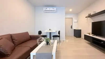 Modern living room with sleek furniture and air conditioning, perfect for comfortable living.