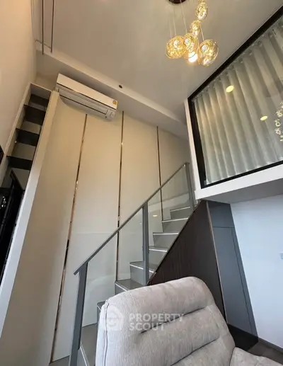 Modern loft apartment with stylish staircase and elegant lighting