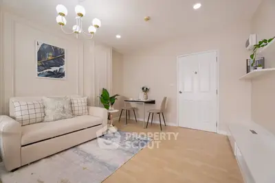 Modern living room with elegant decor and cozy seating area, perfect for relaxation and entertaining.