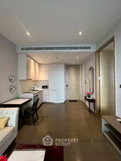 Modern open-plan living room with sleek kitchen and dining area