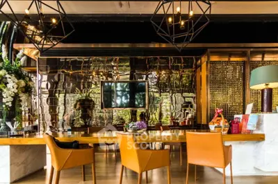 Modern kitchen with sleek design and open layout, featuring a spacious island and contemporary decor.