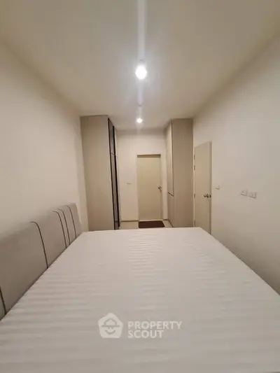 Spacious bedroom with modern design and ample storage space