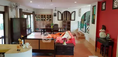 Spacious living room with eclectic decor and natural light