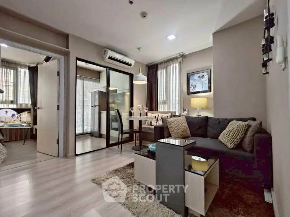 Modern living room with cozy seating and dining area in a stylish apartment.