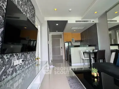 Modern living room with stylish decor and open kitchen layout in a contemporary apartment.