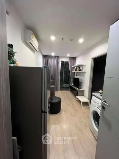 Modern apartment interior with washing machine and sleek decor