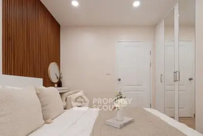 Cozy bedroom with elegant decor and mirrored closet doors