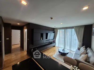 Modern living room with sleek design and large windows for natural light