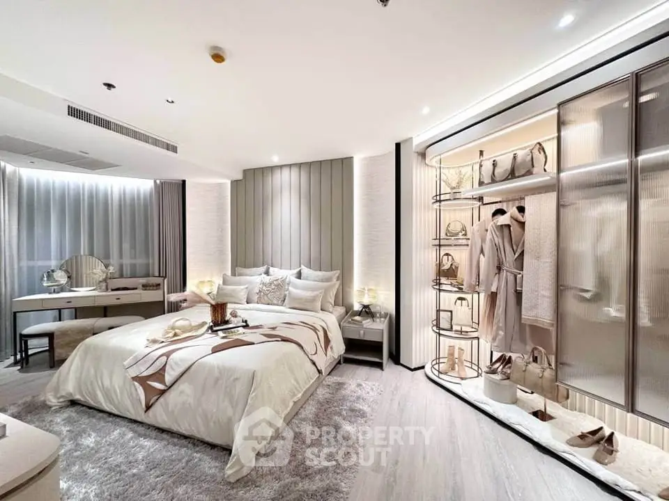 Luxurious modern bedroom with elegant decor and spacious walk-in closet.