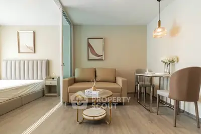 Modern living room with stylish decor and cozy seating in a contemporary apartment.