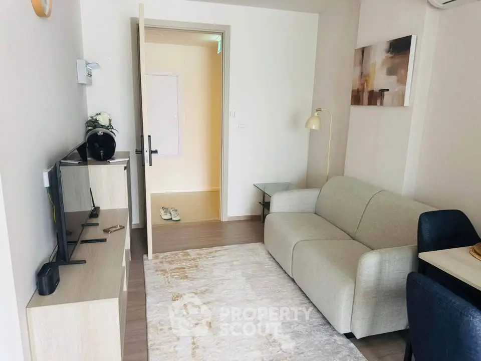 Cozy modern living room with stylish decor and comfortable seating in a contemporary apartment.