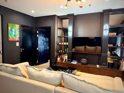 Stylish modern living room with sleek decor and wall-mounted TV