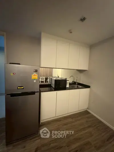 Modern kitchen with sleek design and closed layout