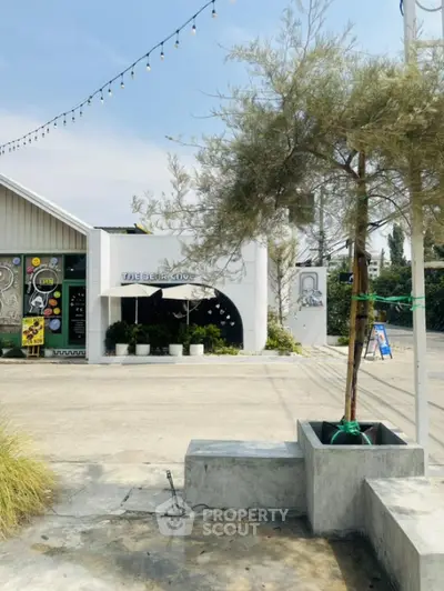 Charming modern building exterior with unique design and lush greenery