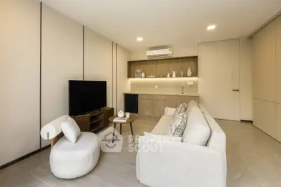 Modern living room with sleek furniture and built-in storage