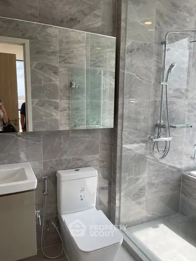 Modern bathroom with sleek fixtures and marble tiles