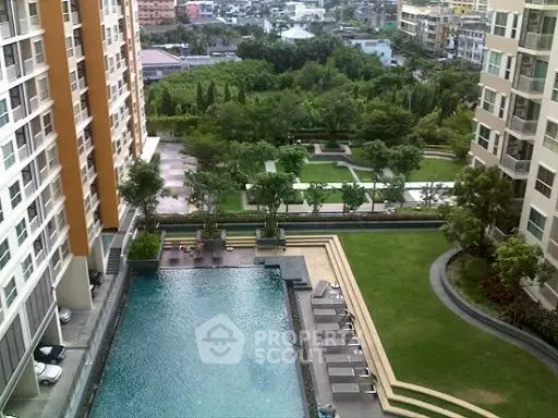 Luxurious condominium with pool and lush garden view in urban setting