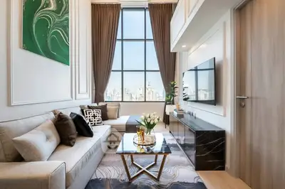 Luxurious high-ceiling living room with city view and elegant decor