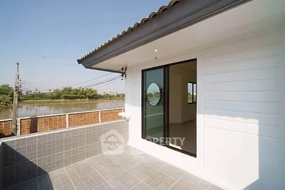 Modern balcony with river view and sliding glass door