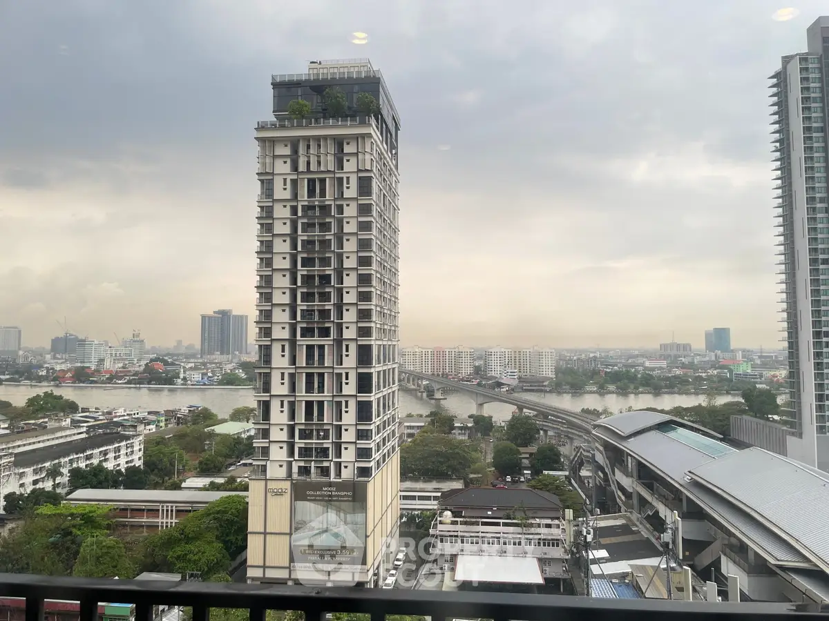 Stunning high-rise building with river view in urban cityscape, perfect for modern living.