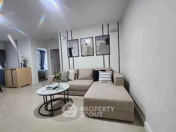 Modern living room with stylish decor and comfortable seating in a contemporary apartment.