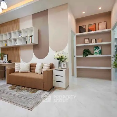 Modern living room with stylish decor, cozy sofa, and elegant shelving in a contemporary apartment.