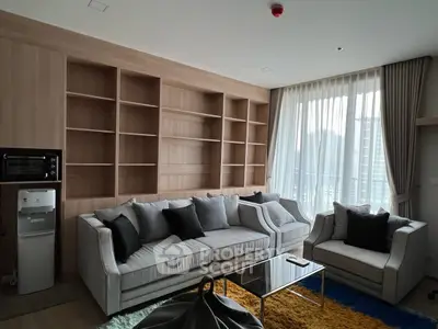 Modern living room with cozy sofas and large windows in a stylish apartment.