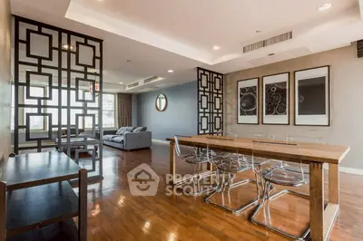 Spacious modern living room with stylish decor and large windows