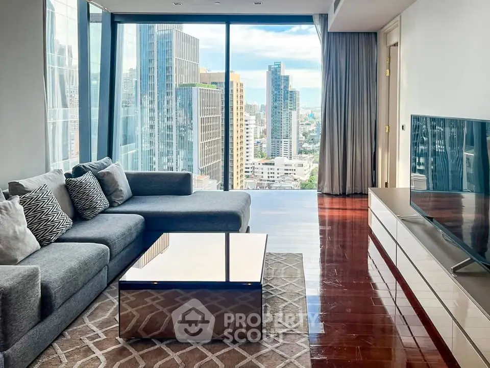 Luxurious high-rise living room with stunning cityscape views and modern furnishings.