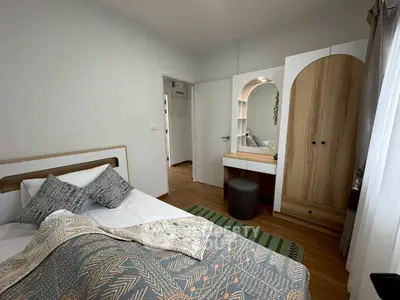Cozy bedroom with stylish decor and natural light