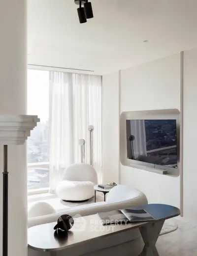 Modern living room with sleek furniture and large window offering city view.