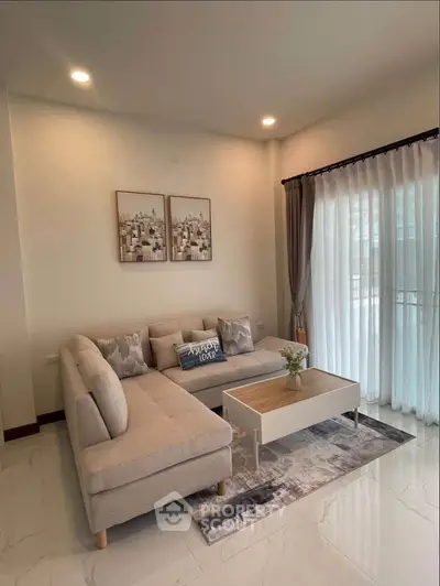Stylish living room with cozy beige sofa and elegant decor