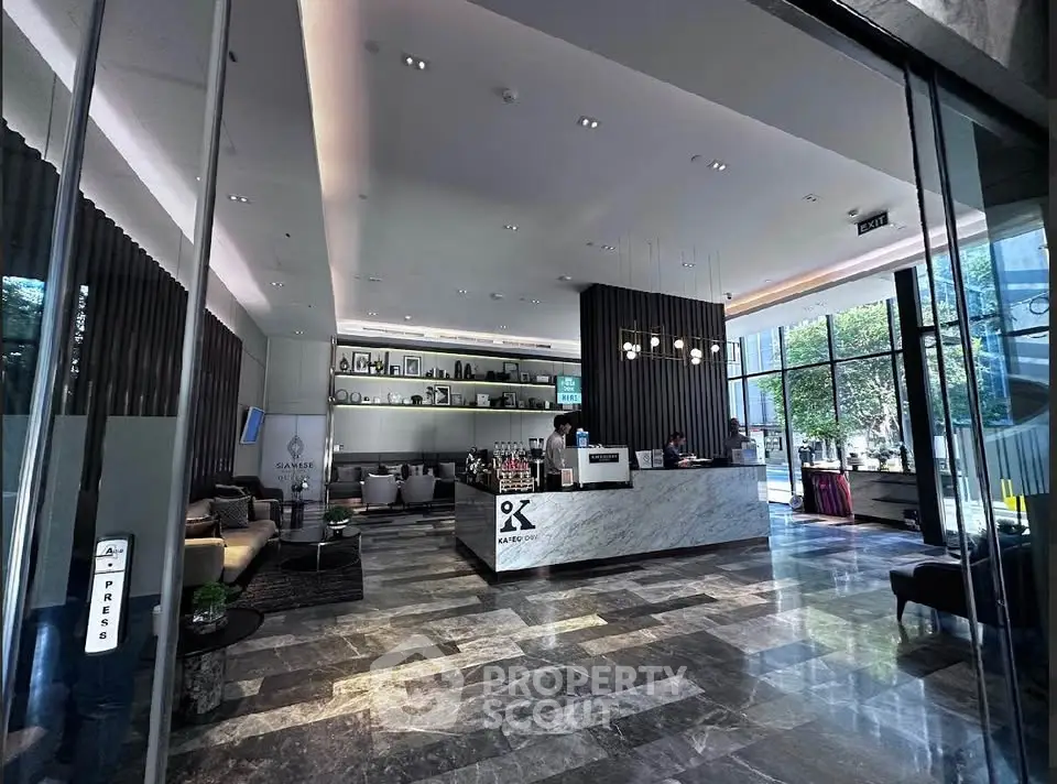 Luxurious building entrance with modern lobby and reception area