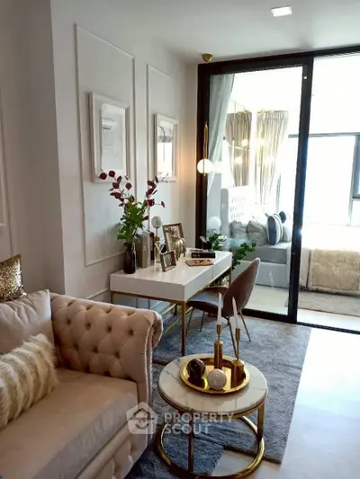 Elegant living room with plush sofa, chic decor, and modern lighting in a stylish apartment.