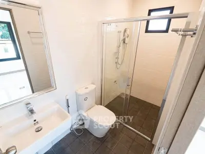 Modern bathroom with glass shower and sleek fixtures