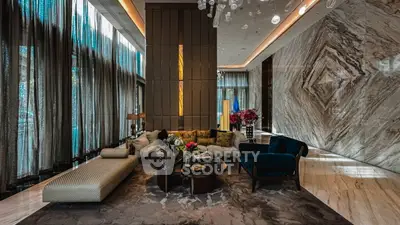 Luxurious living room with elegant decor, high ceilings, and large windows in a modern apartment.
