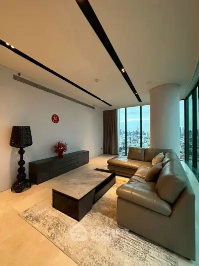 Luxurious living room with panoramic city view and modern leather sofa